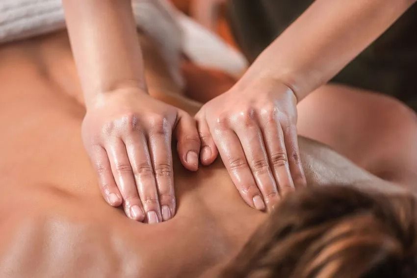 A woman is getting a massage at a spa.