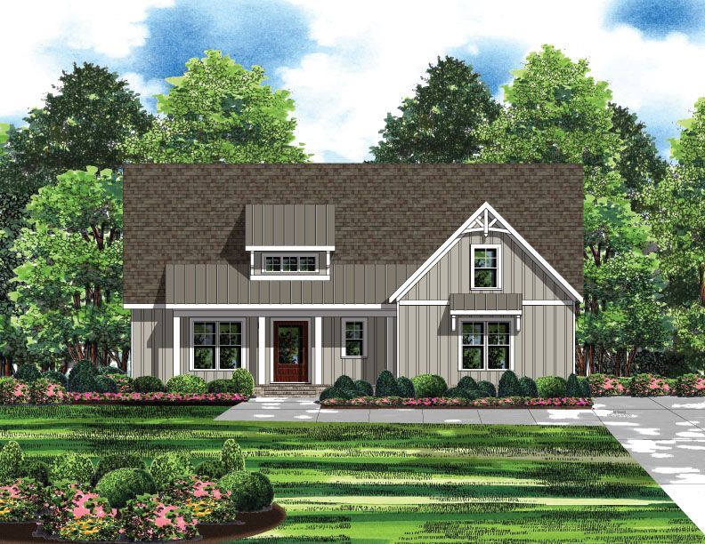 A large blue house with a large porch is sitting on top of a dirt field.
