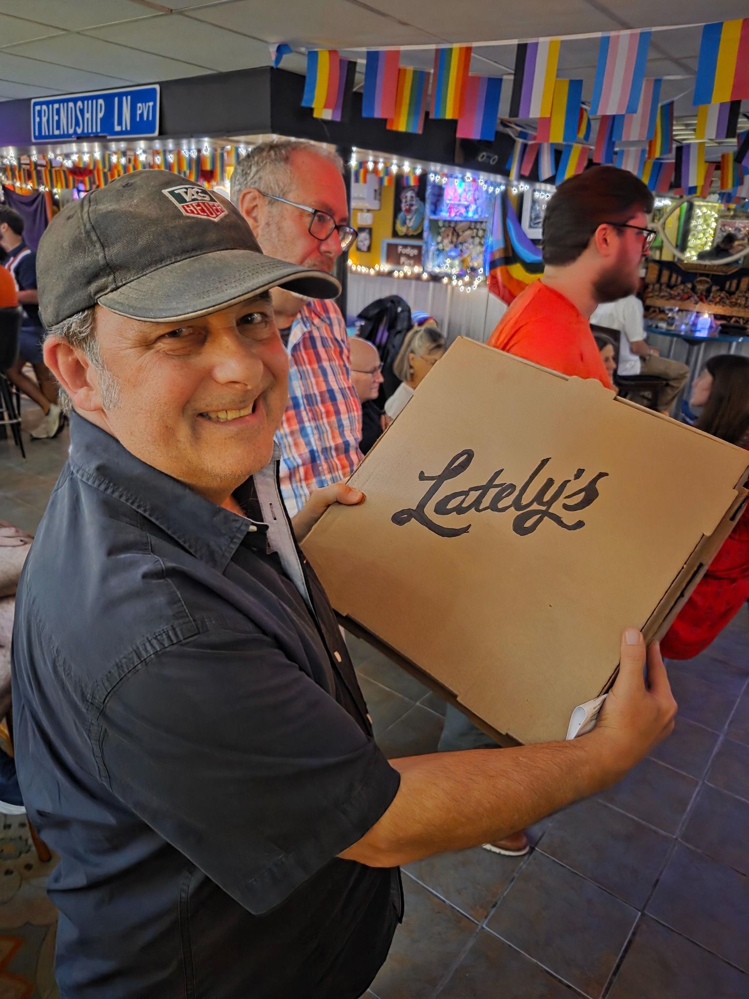 Man in a cap holding a 