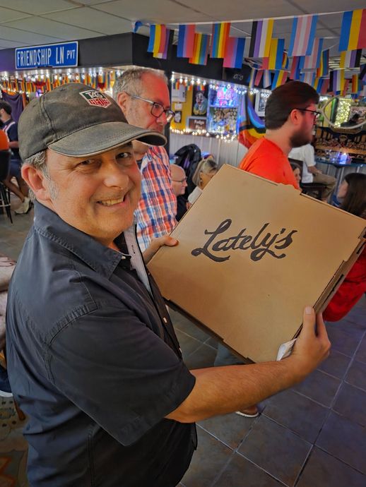 Man in a cap holding a 