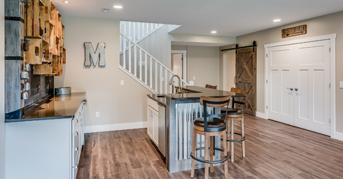 There is a staircase leading up to the second floor in the basement.