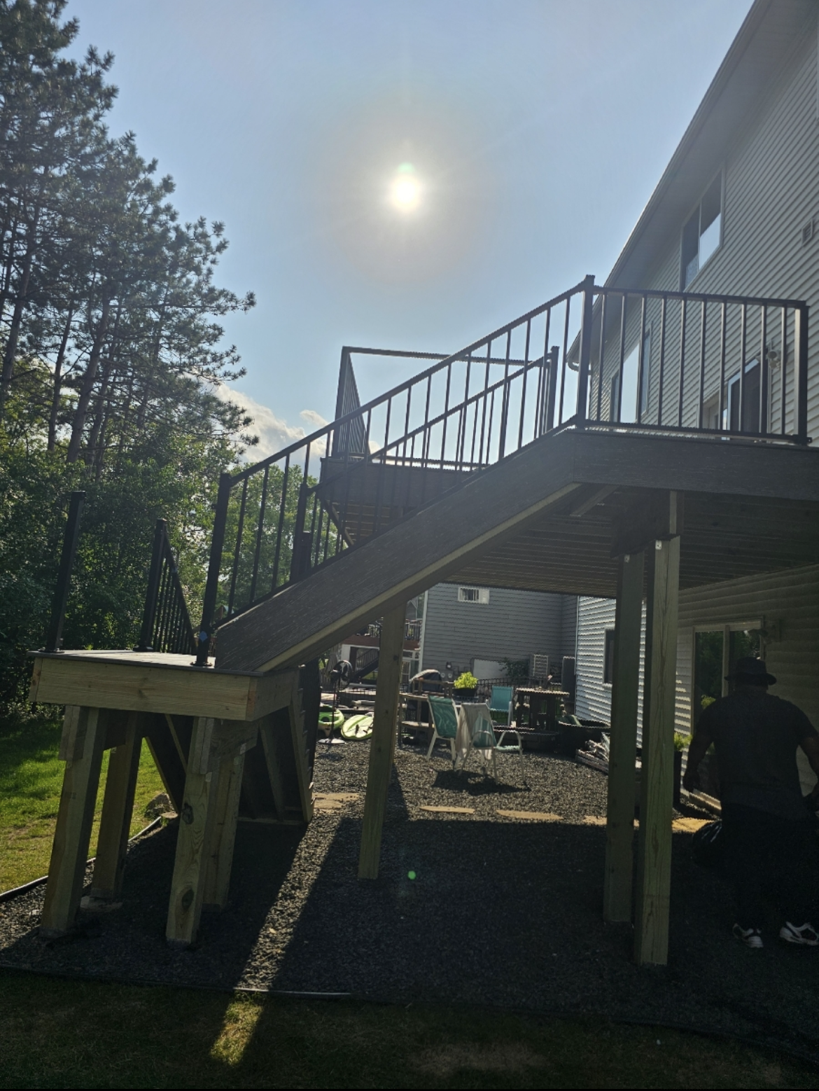 A wooden deck with stairs leading up to it