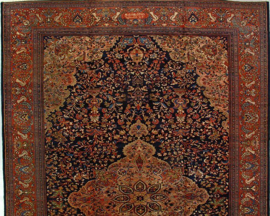 A close up of a rug with a floral pattern on it.