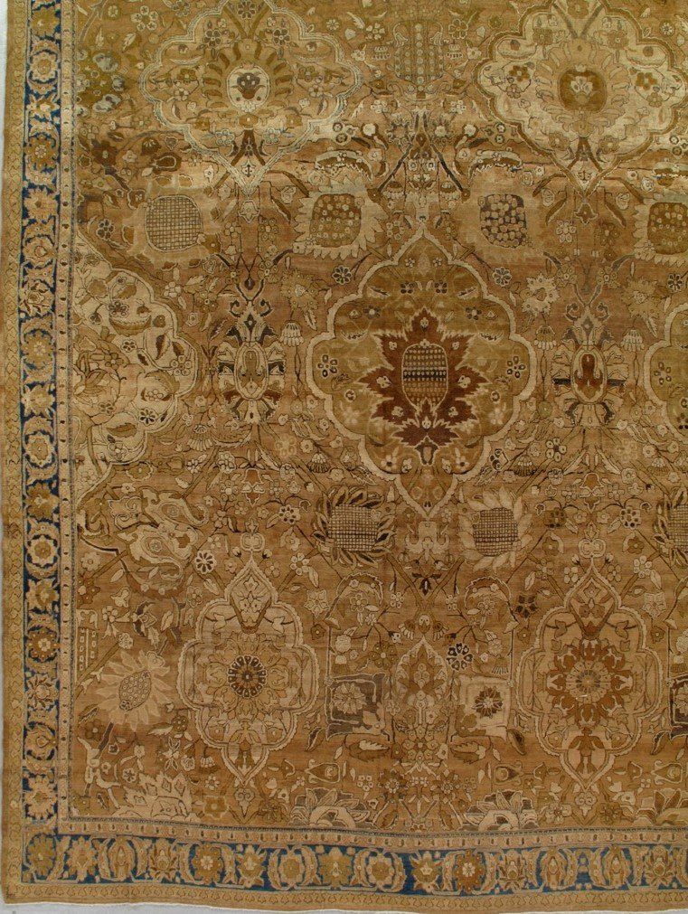 A close up of a rug with a floral pattern on it.