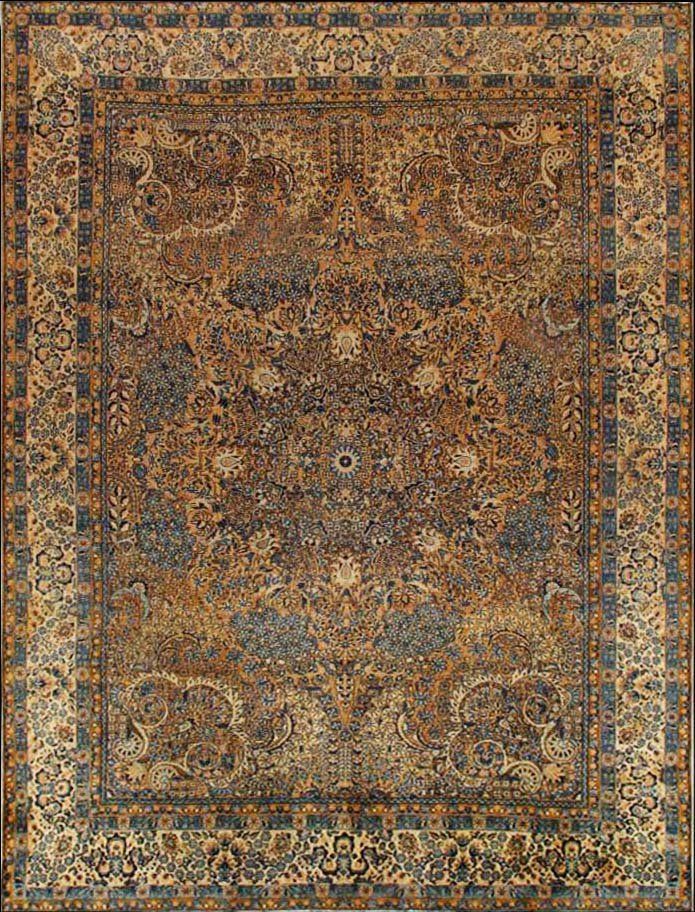 A close up of a rug with a floral pattern on it.