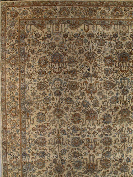 A rug with a pattern of flowers and leaves on it