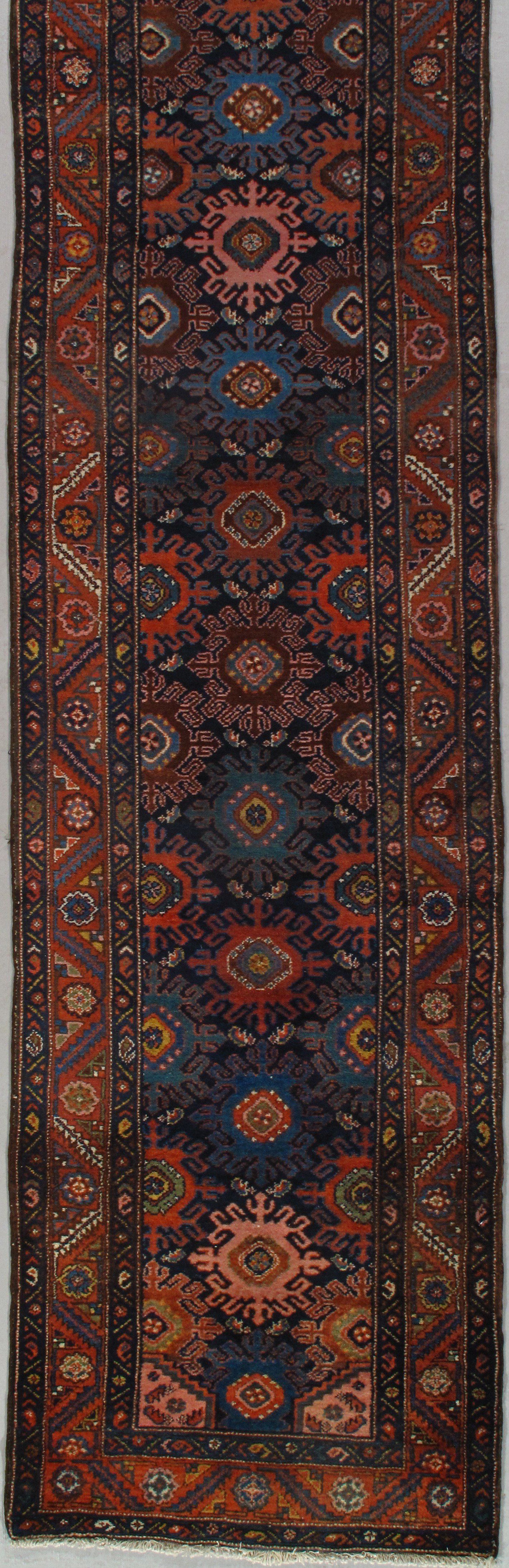 A close up of a rug with a floral pattern on it.