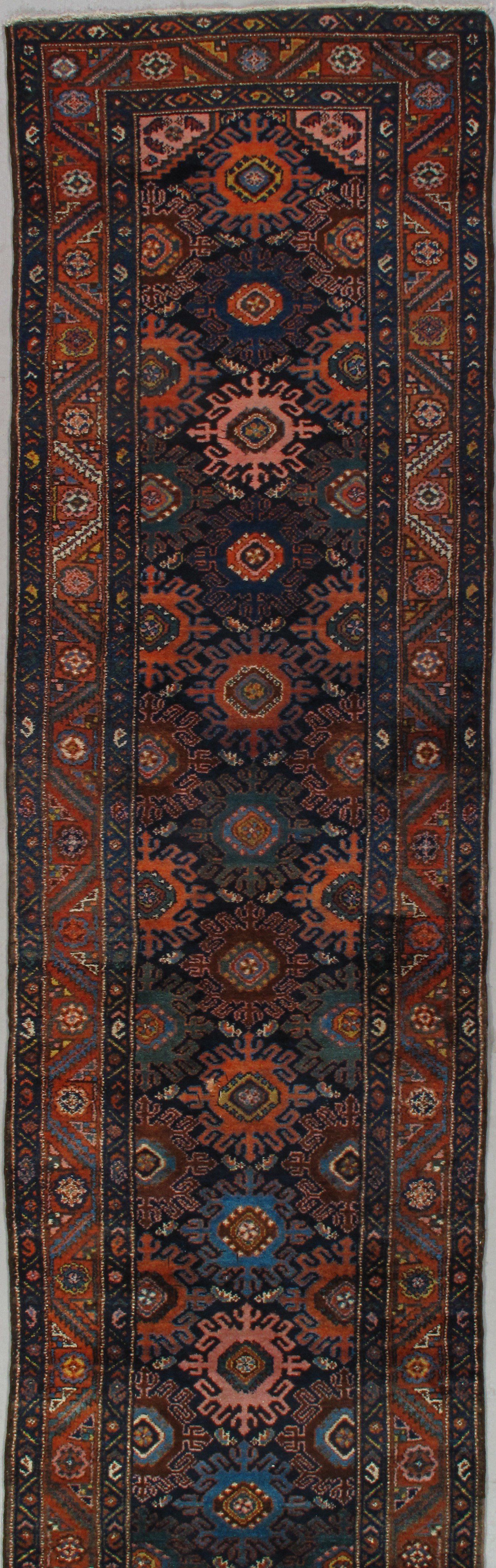 A close up of a rug with a floral pattern on it.
