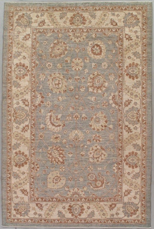 A rug with a floral pattern on it is sitting on a table.
