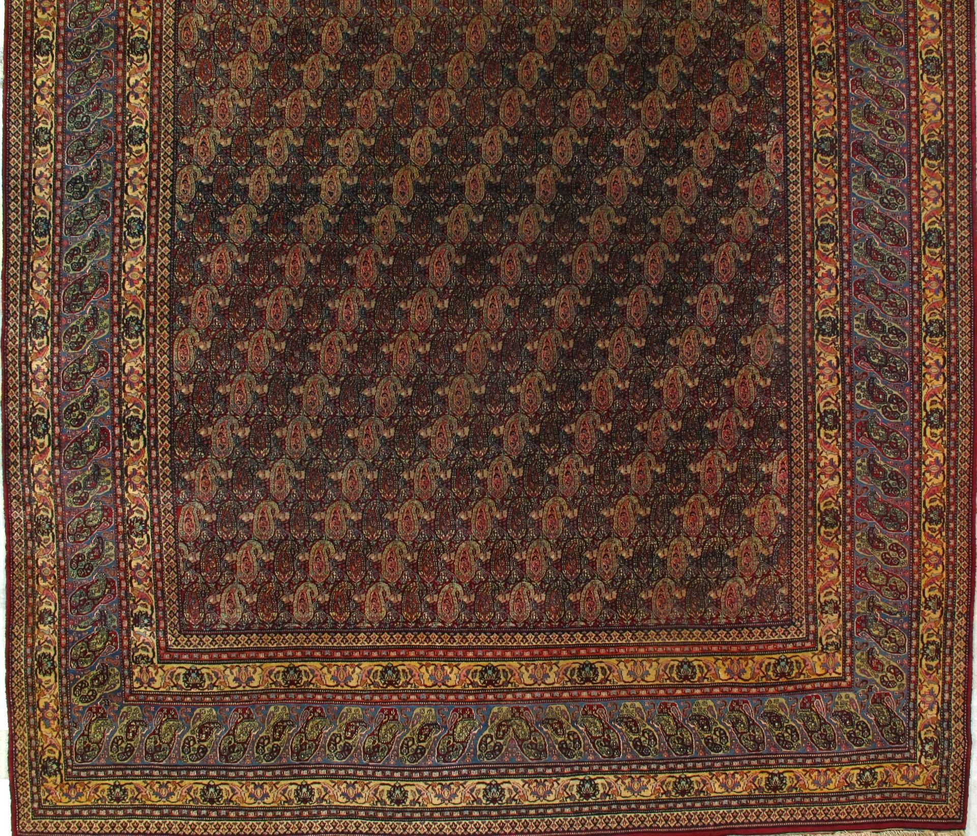 A rug with a floral pattern and a gold border