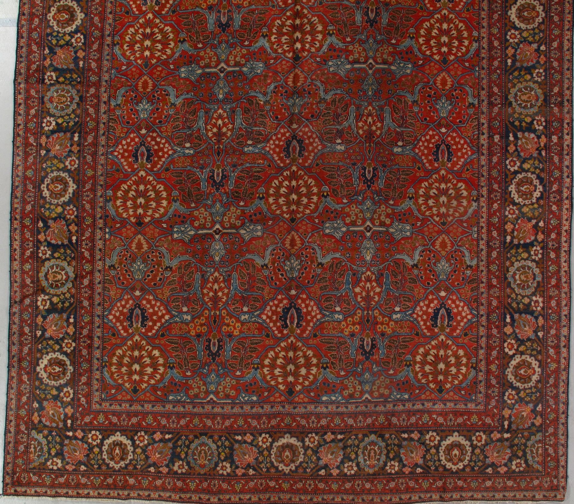 A rug with a floral pattern on it is sitting on a table.