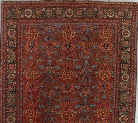 A rug with a floral pattern on it is sitting on a table.