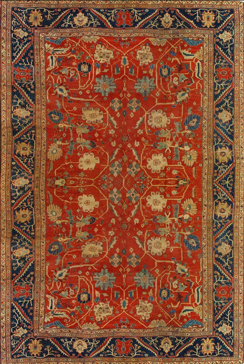 A red rug with a floral pattern on it