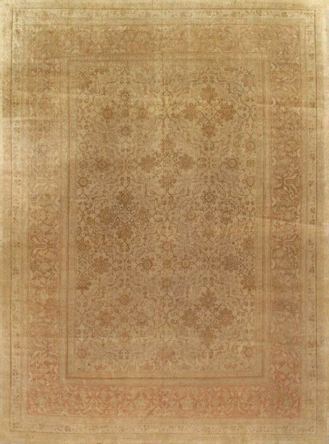 A close up of a square rug with a floral pattern on it.
