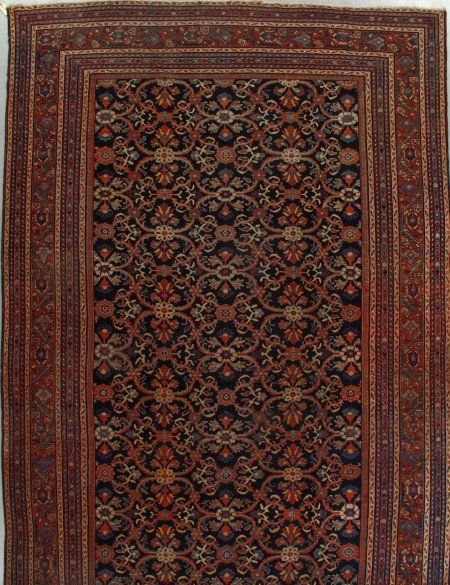 A rug that has a floral pattern on it