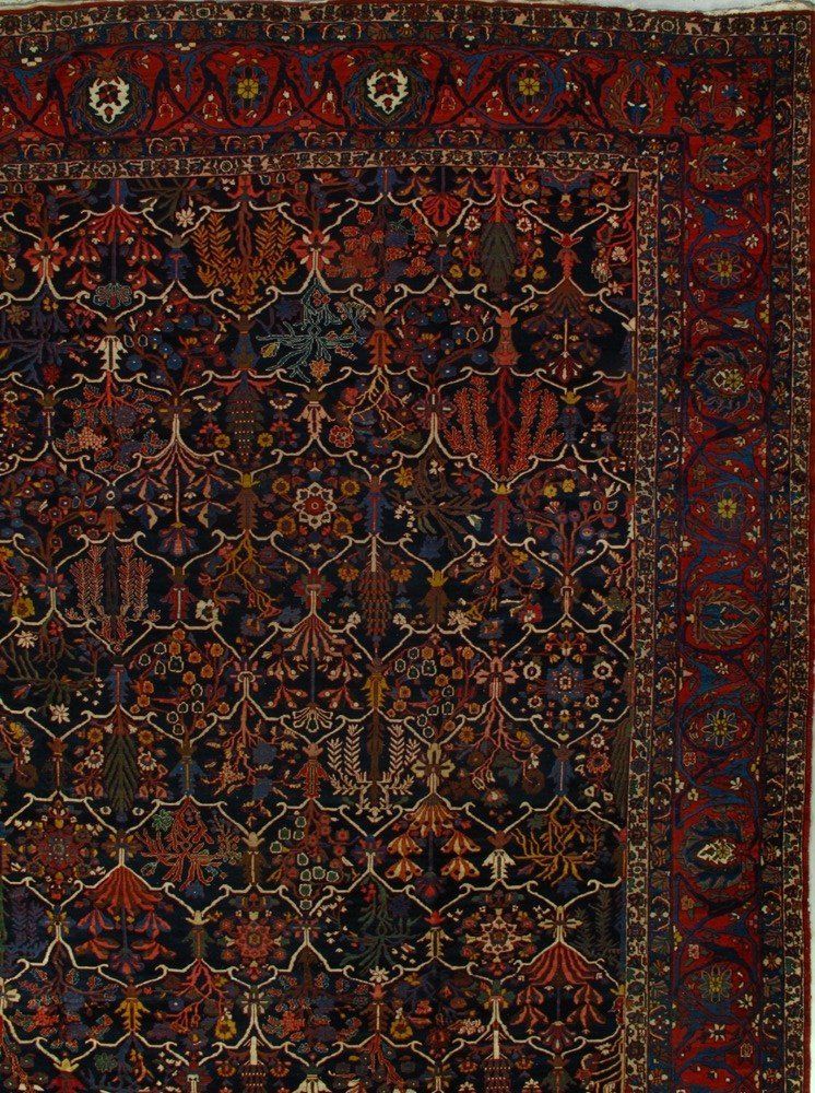 A rug with a floral pattern on it is on a white background.