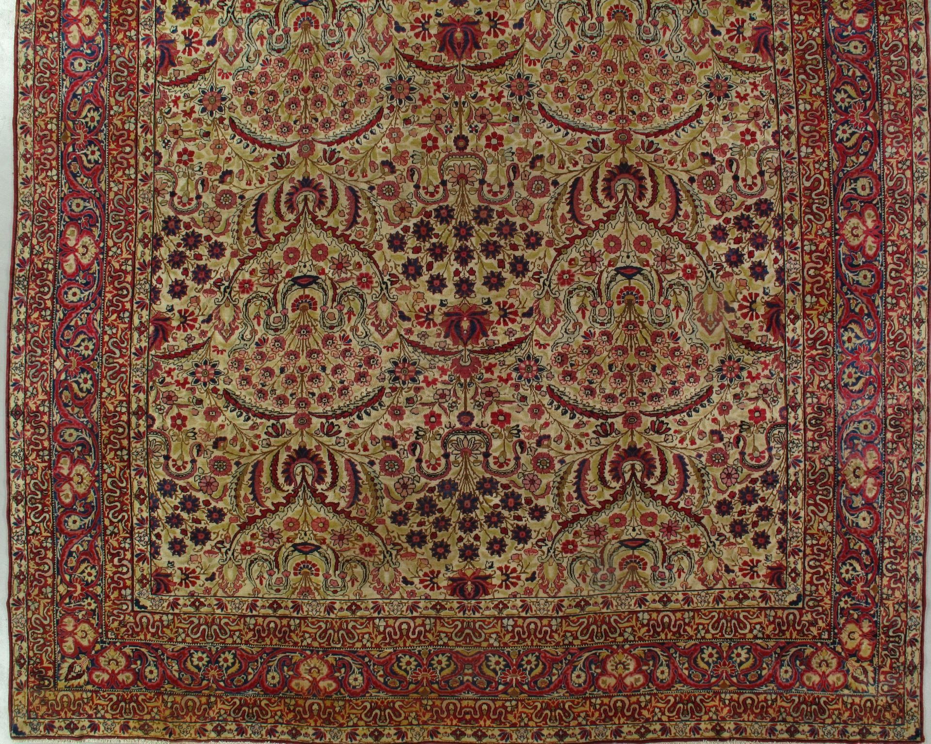 A close up of a rug with a floral pattern on it
