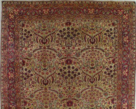 A close up of a rug with a floral pattern on it