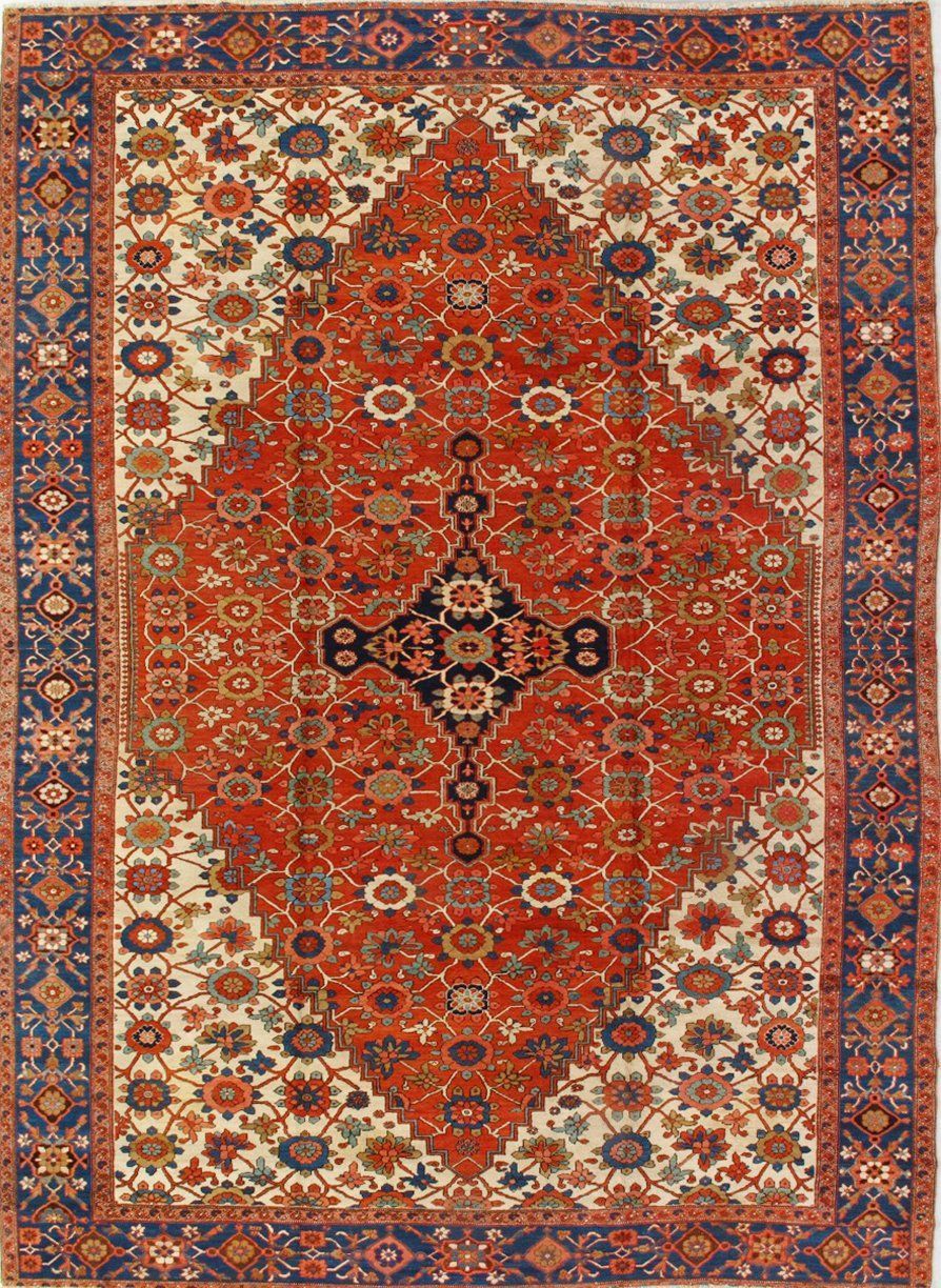 A red rug with a blue border and a floral pattern