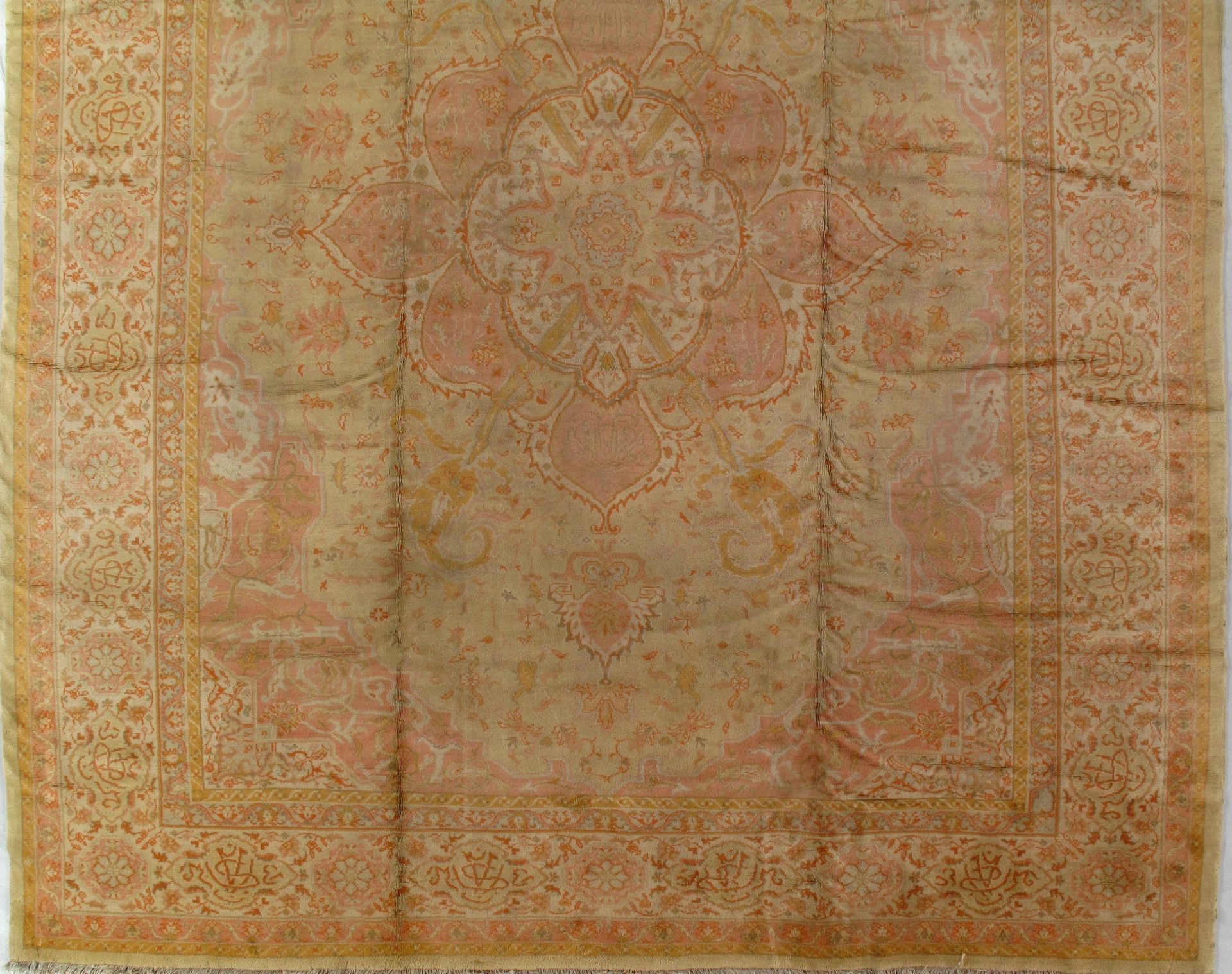 A rug with a floral pattern on it is sitting on a table.
