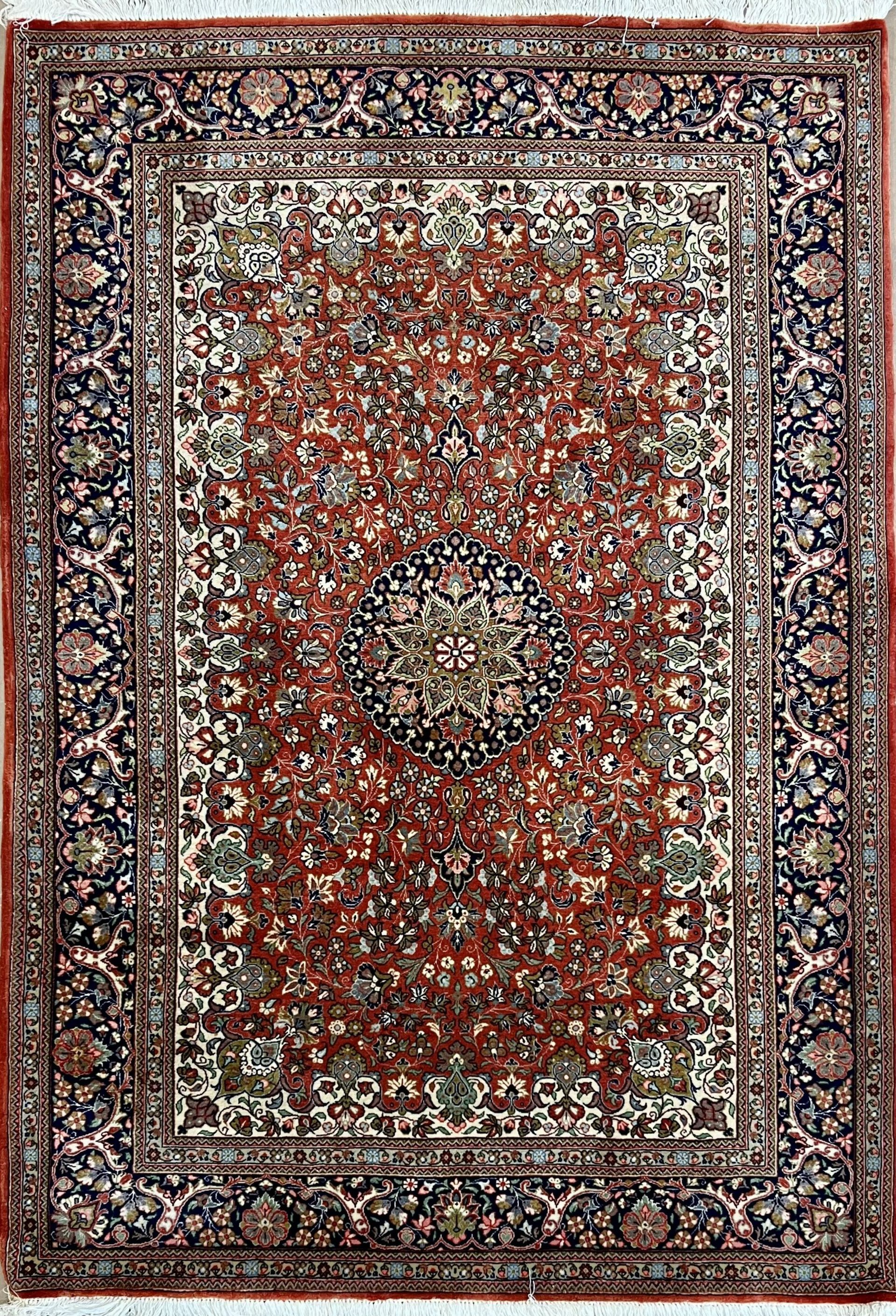 A close up of a rug with a floral pattern on it.