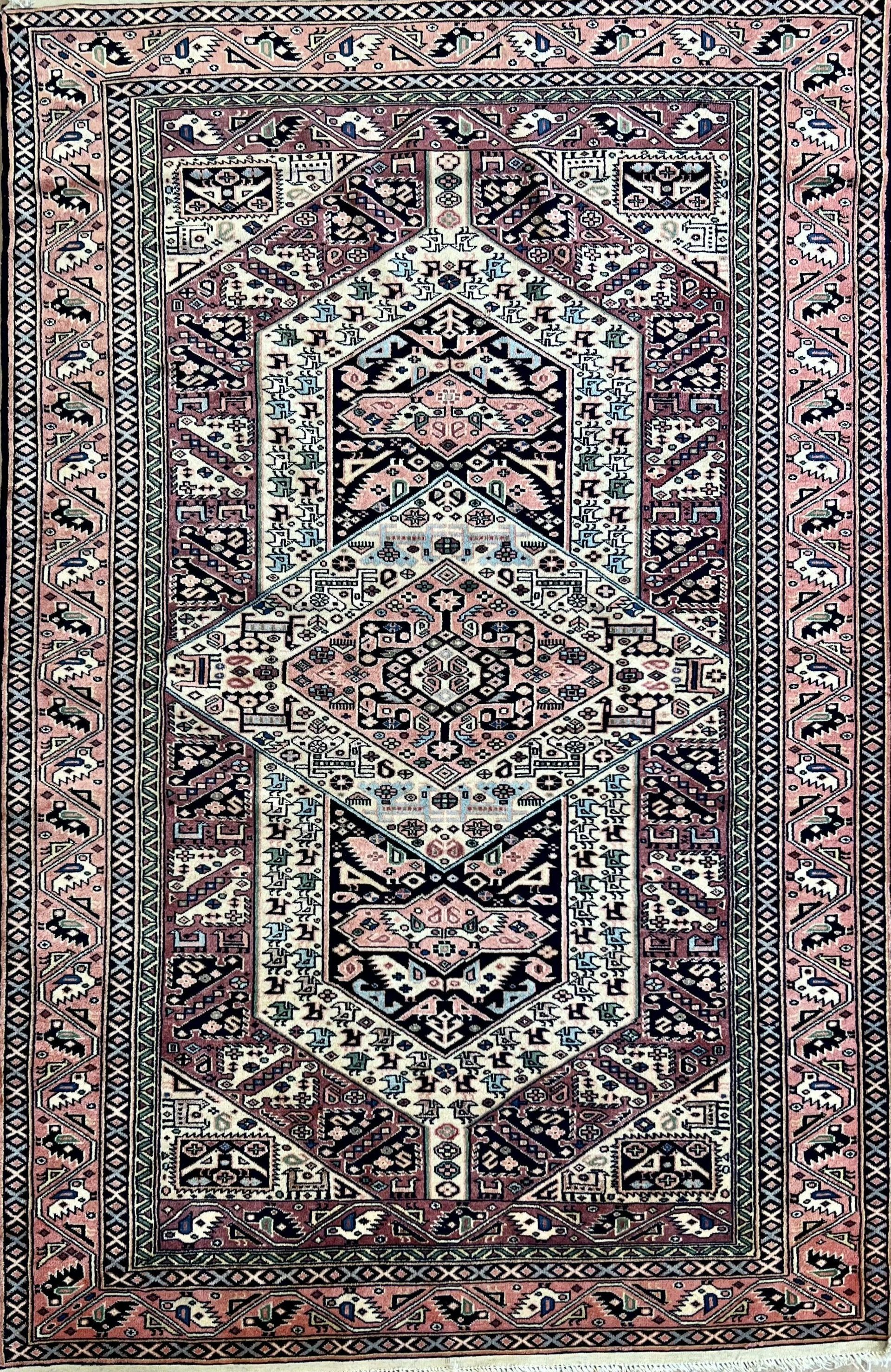 A rug with a floral pattern on it is sitting on a table.