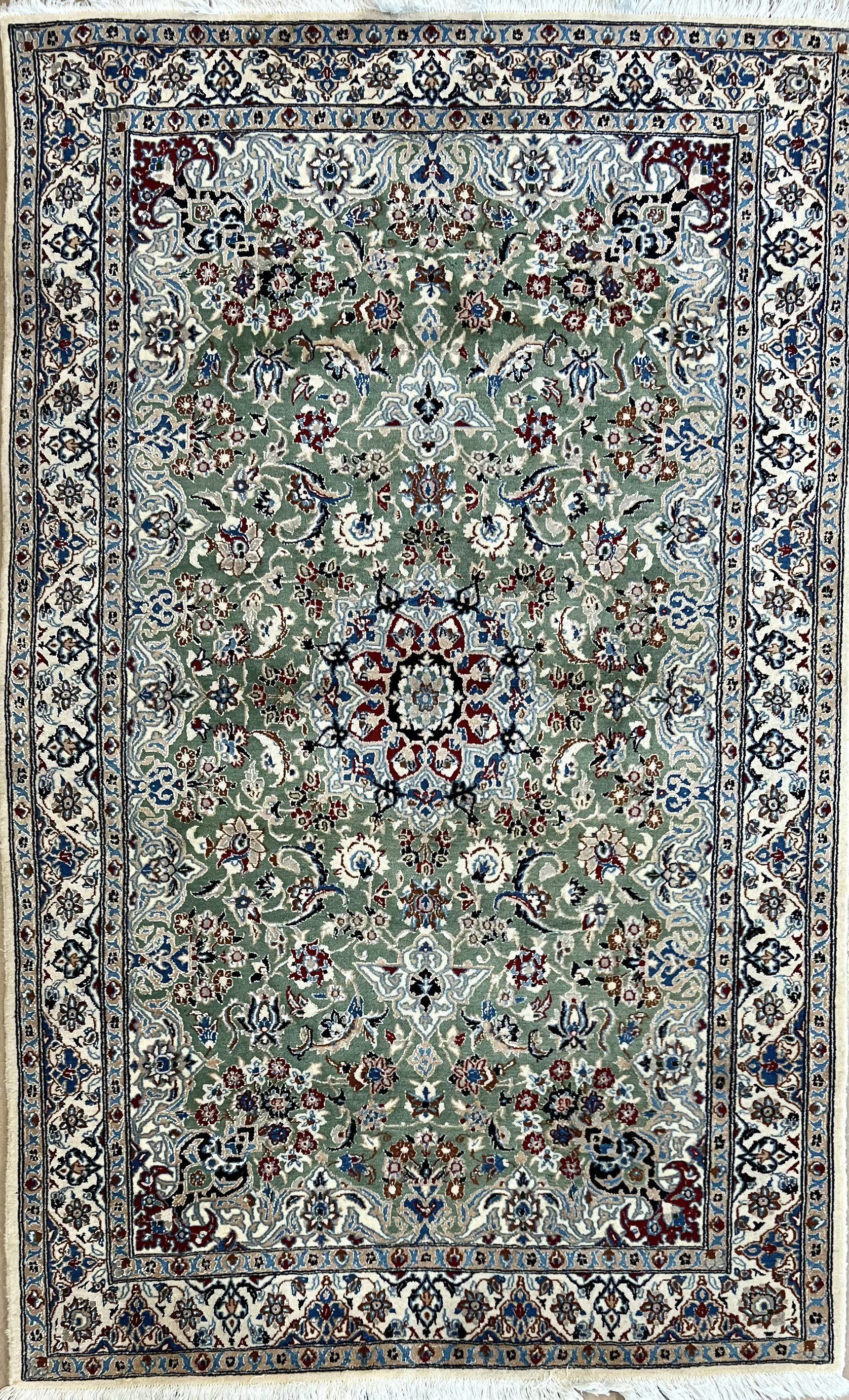 A rug with a floral pattern on it is sitting on a table.