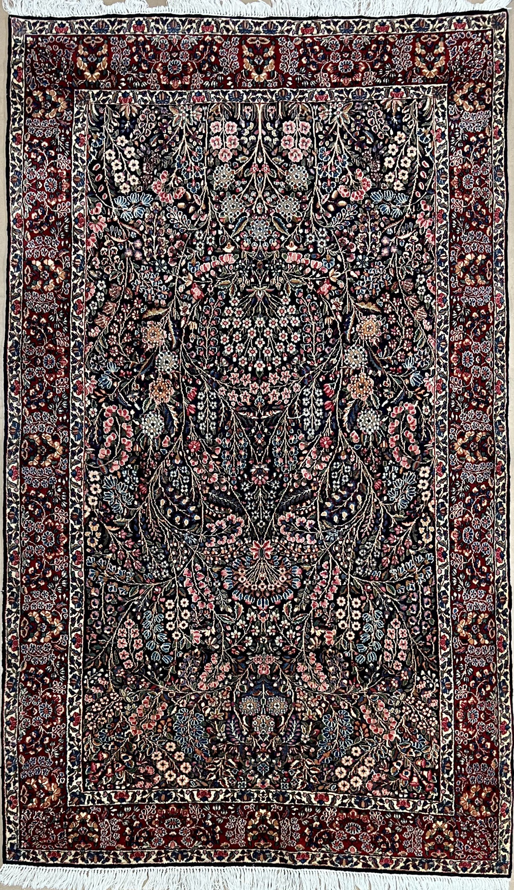 A close up of a rug with a floral pattern on it.