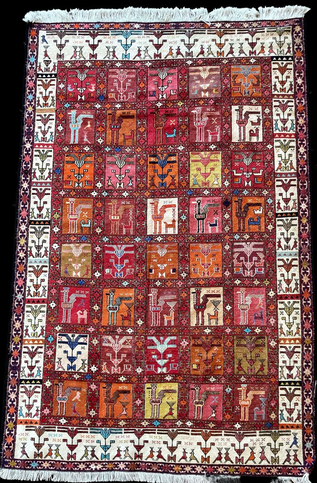 A rug with a pattern of squares and letters on it.