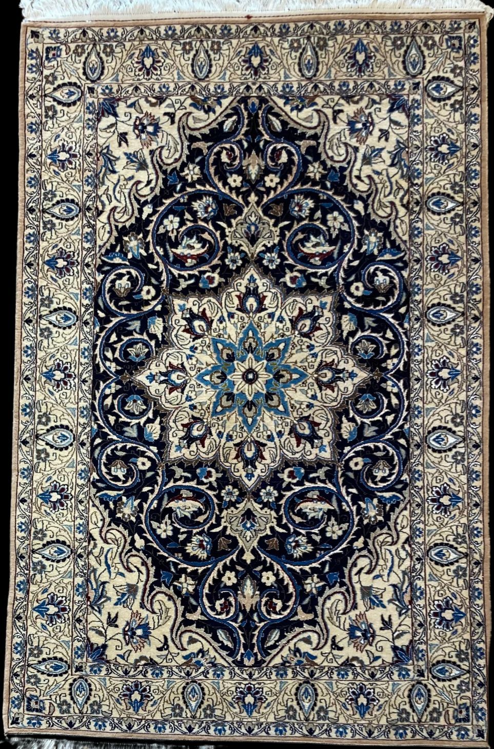 A rug with a blue and white pattern on it is sitting on a table.