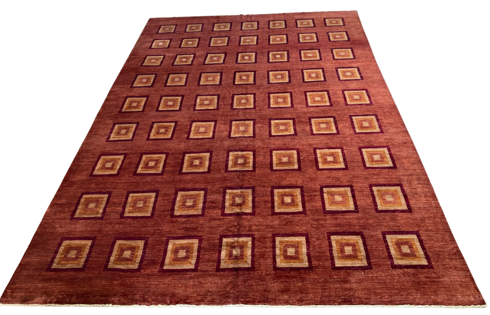 A brown rug with squares on it on a white background