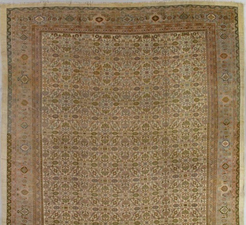 A rug with a floral pattern on it is sitting on a table.