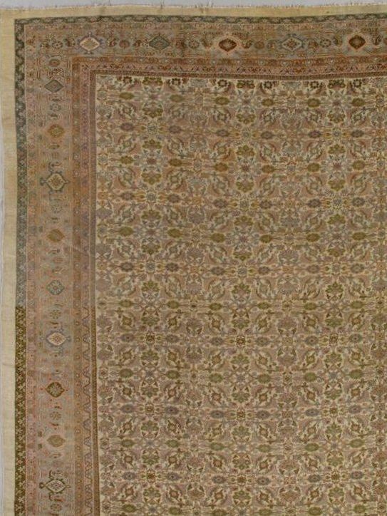 A rug with a floral pattern on it is sitting on a table.