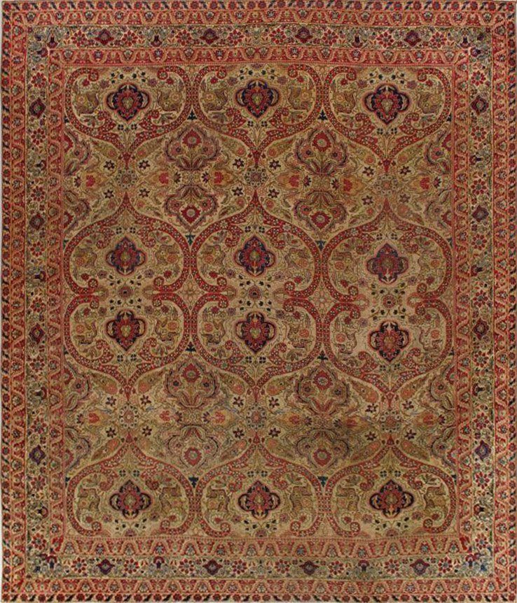 A rug with a floral pattern on it is on a white background.