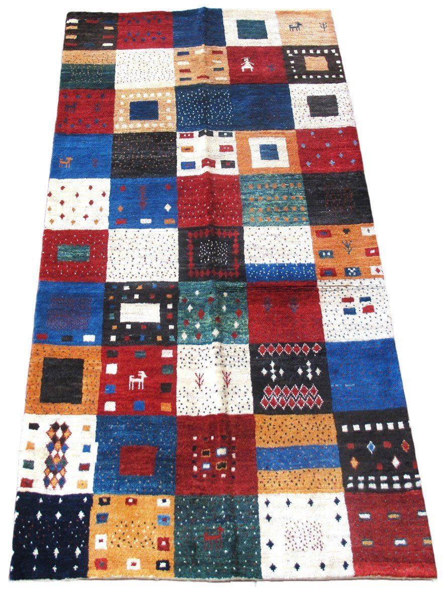 A colorful rug with squares and circles on it