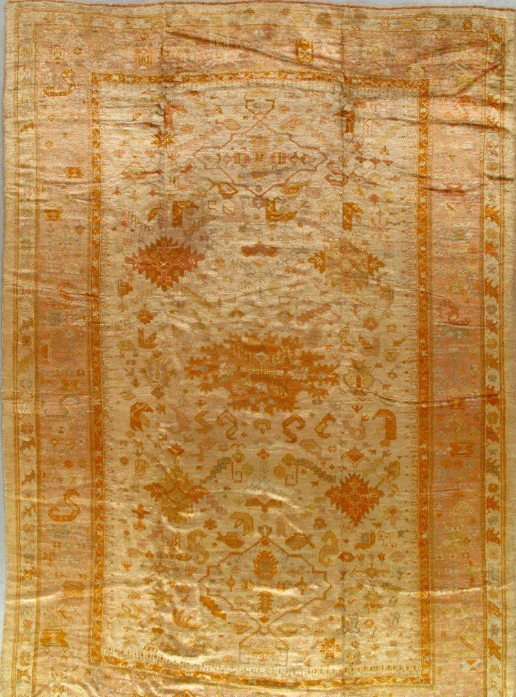 A close up of a rug with a floral pattern on it.