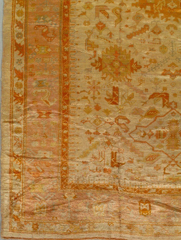 A close up of a rug with a floral pattern on it.