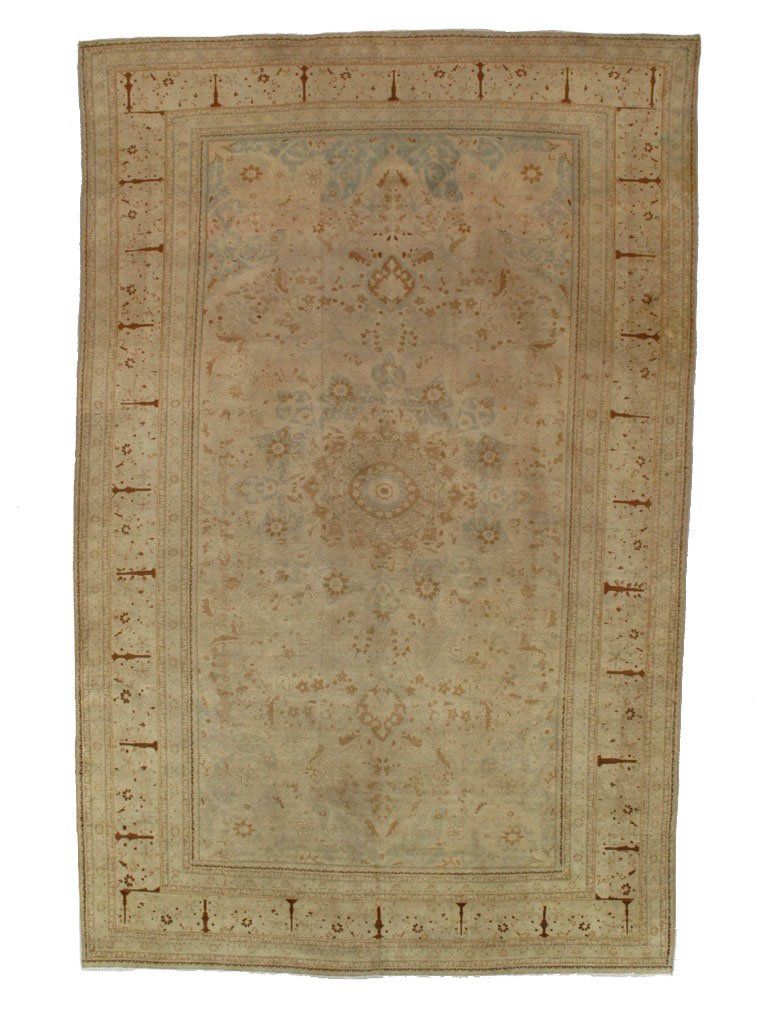 A rug with a floral pattern on it is on a white background