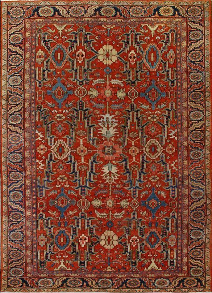 A red rug with a floral pattern on it