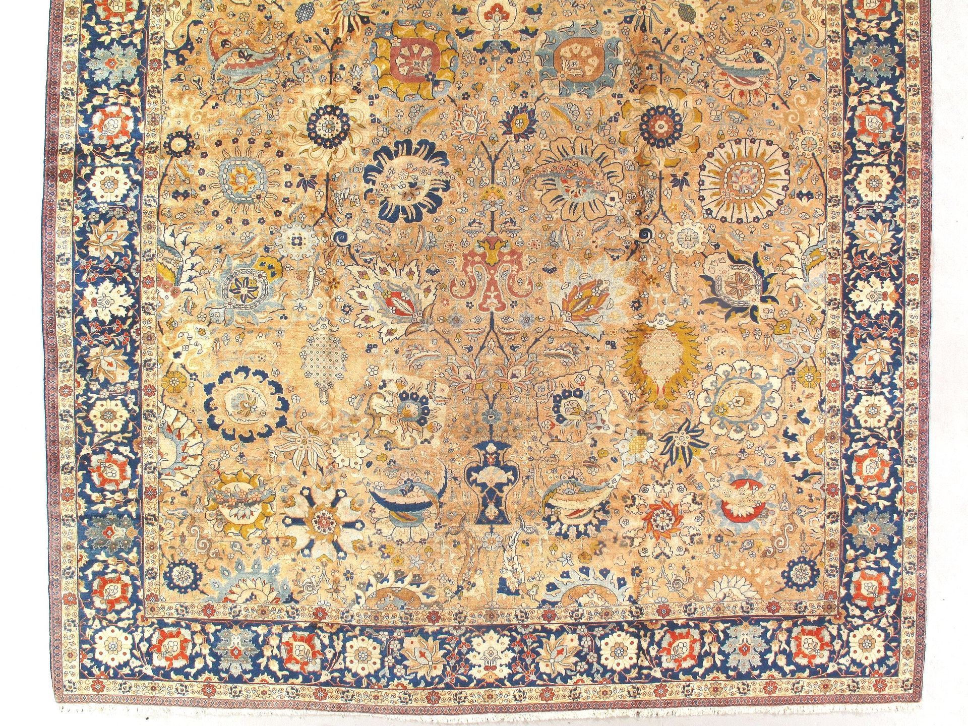 A close up of a rug with a floral pattern on a white background.