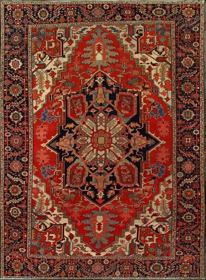 A red rug with a floral pattern on it