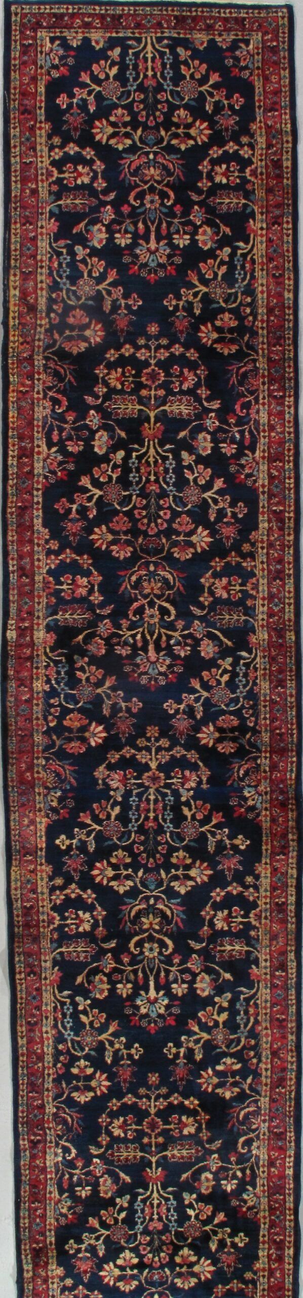 A rug with a floral pattern on it is sitting on a table.
