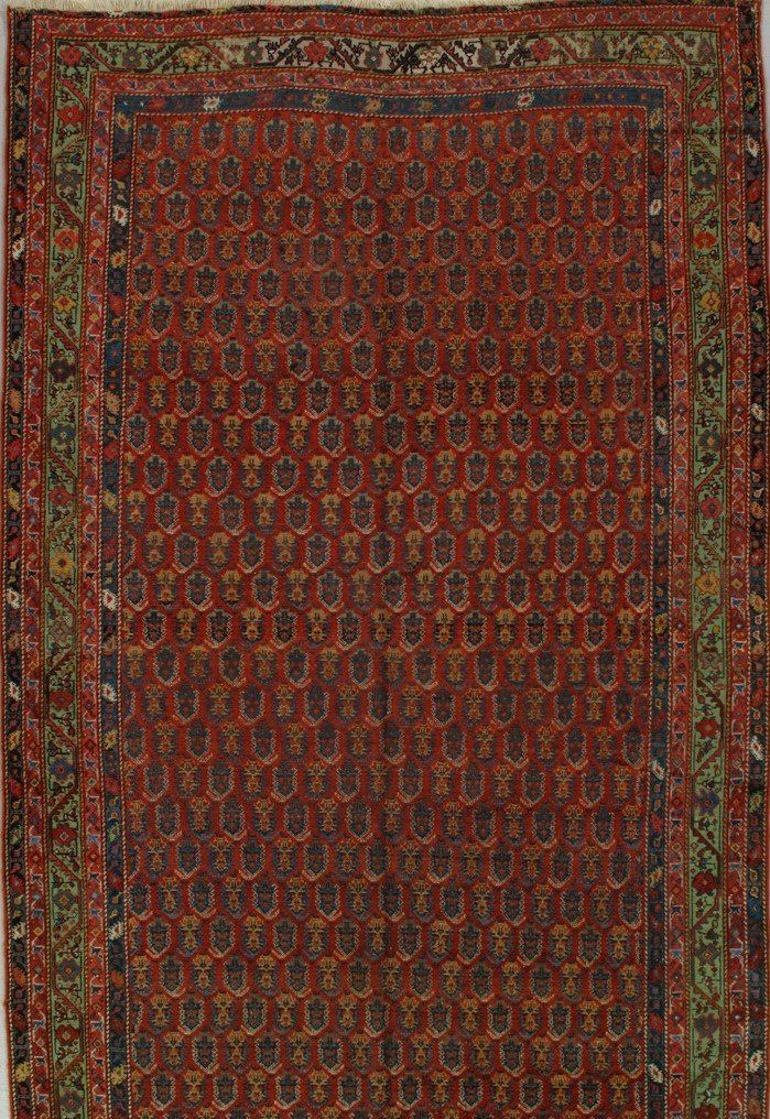 A red rug with a pattern of circles on it