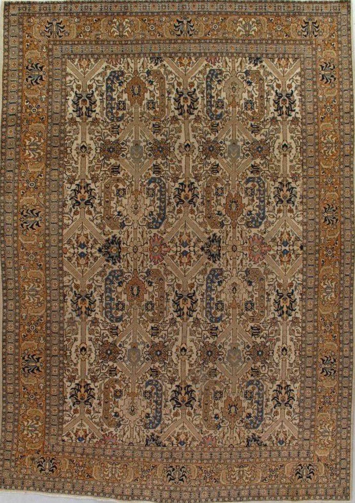 A rug with a pattern on it is hanging on a wall.