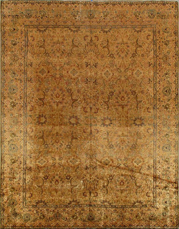 A close up of a brown rug with a floral pattern on it.