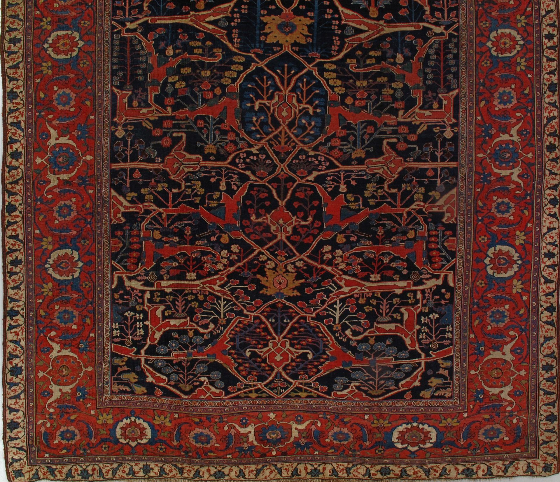 A rug with a blue background and red border