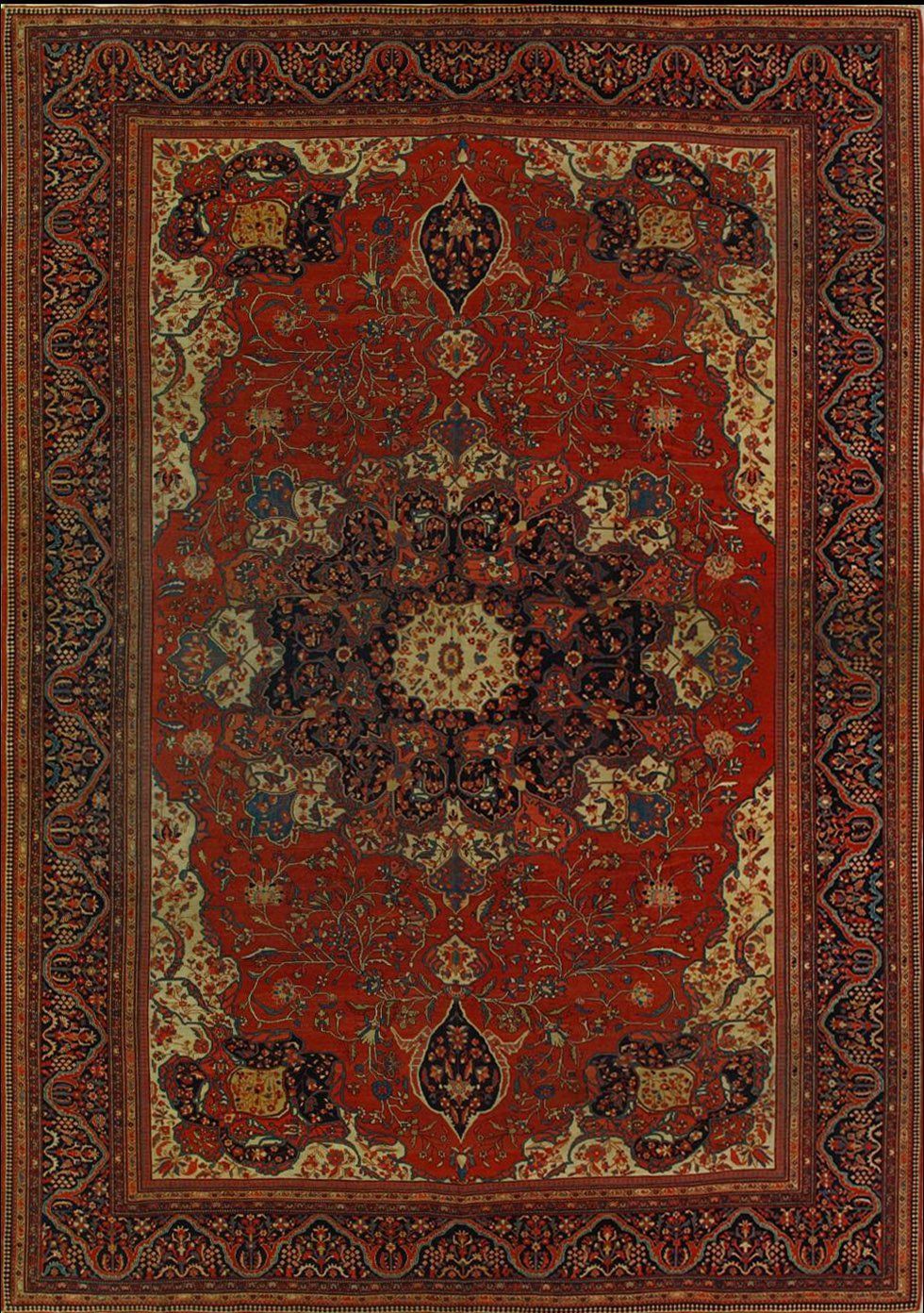 A red rug with a floral pattern on it