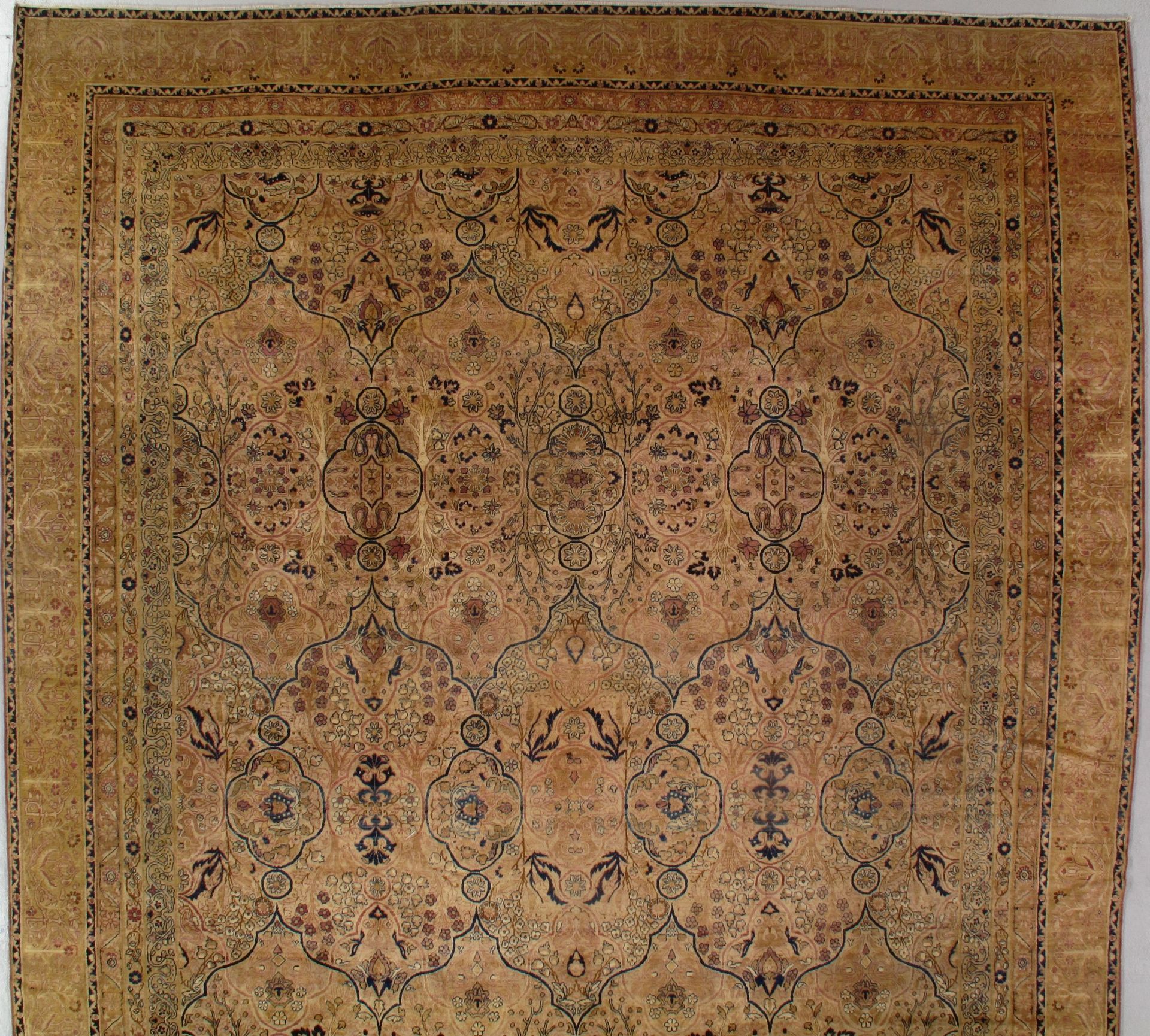 A brown rug with a floral pattern on it