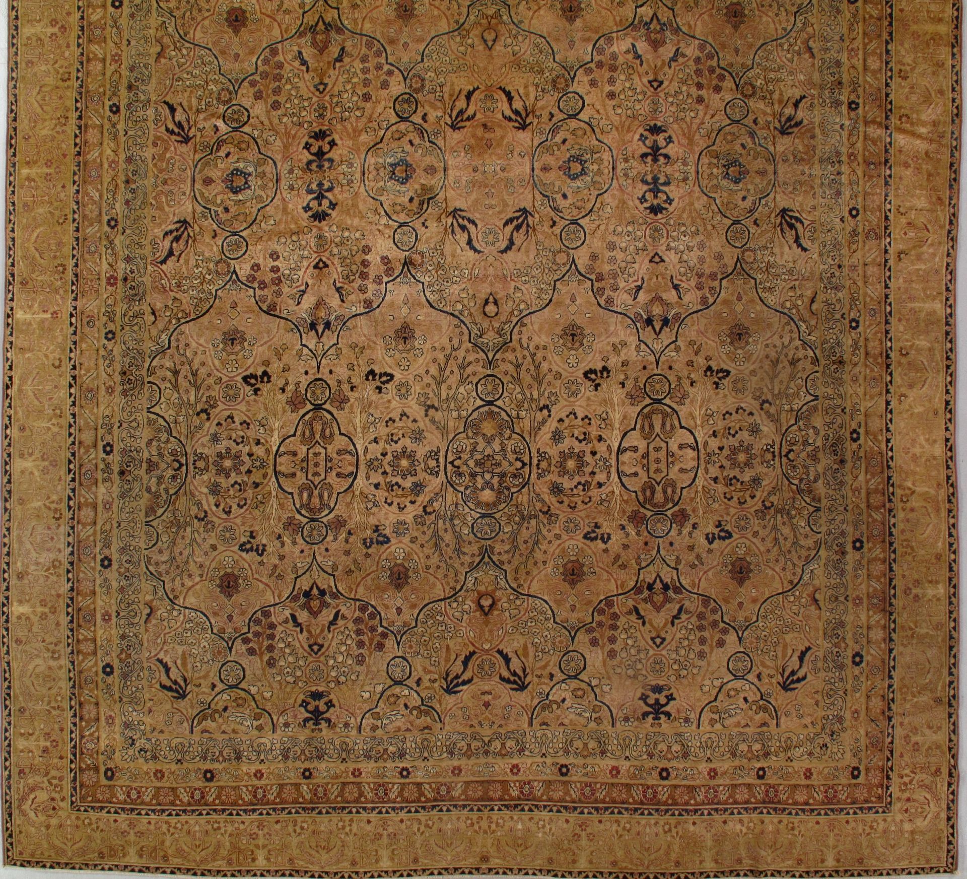 A brown rug with a floral pattern on it