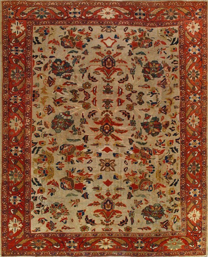 A rug with a floral pattern and a red border